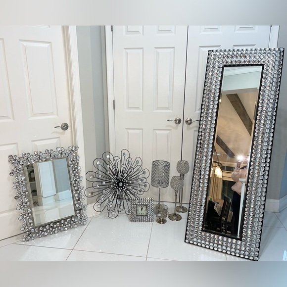 2 mirrors 1 lamp 1 candle holder 1 clock & a flower wall decor